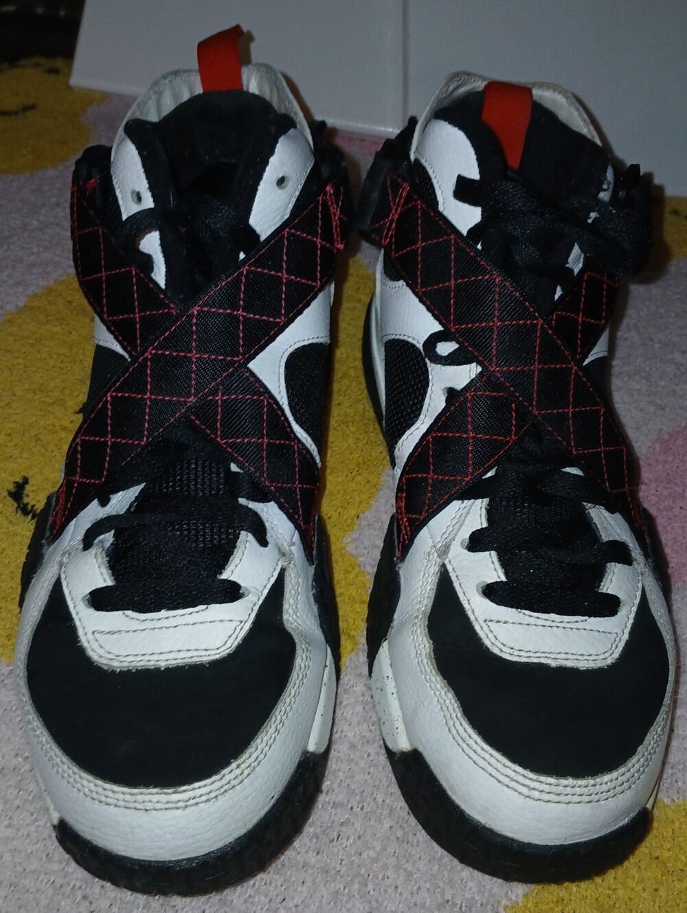 Pre-loved Nike Airband Black and White High-Top Sneakers w/Red Stitching Straps.
